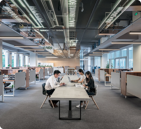 Spacious office with open workstations and teamwork